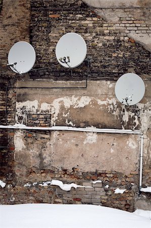 radio communication antenna - Satellite dishes on a old wall in winter Stock Photo - Budget Royalty-Free & Subscription, Code: 400-06076895