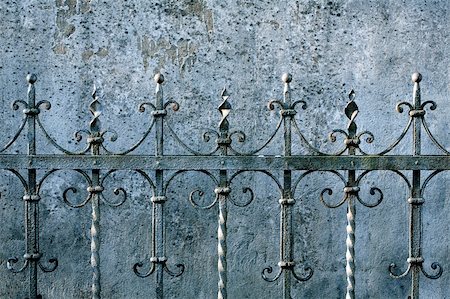 Old metal fence detail and a wall Stock Photo - Budget Royalty-Free & Subscription, Code: 400-06076893