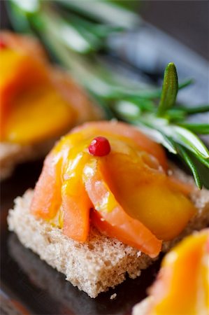 simsearch:400-08070549,k - Smoked salmon canape with sauce for party. Stockbilder - Microstock & Abonnement, Bildnummer: 400-06077163