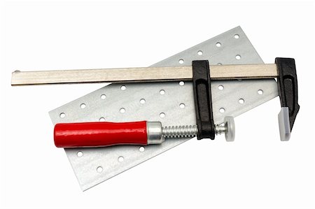 simsearch:400-05058869,k - Tools collection - Open carpentry screw clamp with red handle isolated on white background Foto de stock - Royalty-Free Super Valor e Assinatura, Número: 400-06077173