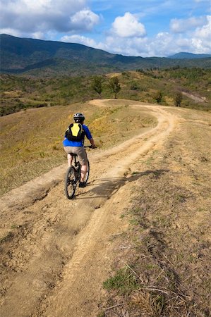 mountain biker on the  track Foto de stock - Super Valor sin royalties y Suscripción, Código: 400-06077242