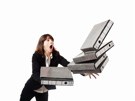 stressful women at the office with piles of work - Woman in the office stumbling with a pile of folders in the hands, isolated on white Stock Photo - Budget Royalty-Free & Subscription, Code: 400-06077599