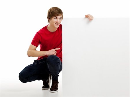 simsearch:400-05368656,k - Portrait of a happy young man showing something on a blank white card Stockbilder - Microstock & Abonnement, Bildnummer: 400-06077634