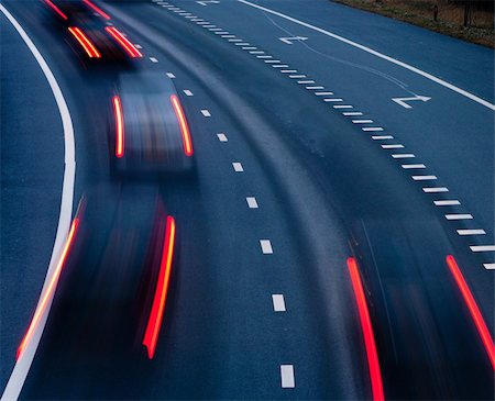 road motion blur curved - blurred lights of cars on a highway at evening Stock Photo - Budget Royalty-Free & Subscription, Code: 400-06077705