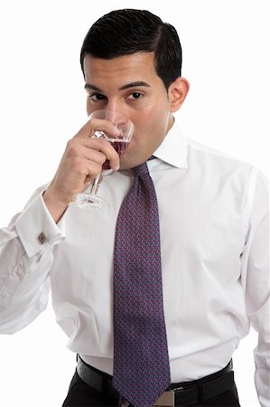simsearch:400-04313696,k - A man tasting or drinking a glass of sparkling red wine made from shiraz grapes.  White background. Photographie de stock - Aubaine LD & Abonnement, Code: 400-06077952