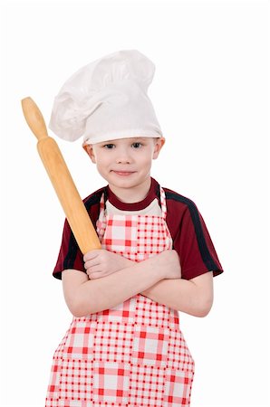boy in chef's hat stand crossed arms isolated on white background Stock Photo - Budget Royalty-Free & Subscription, Code: 400-06078452