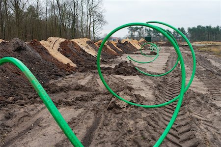 green fiber cable ready to go into the ground on a newly build industrial area Photographie de stock - Aubaine LD & Abonnement, Code: 400-06078730