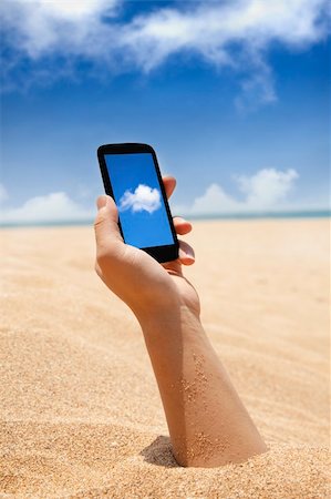 smart phone in hand and beach view with cloud computing concept Stock Photo - Budget Royalty-Free & Subscription, Code: 400-06078787