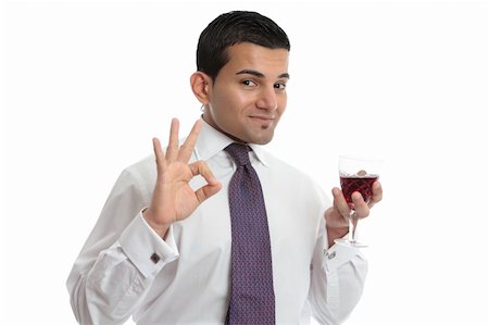 simsearch:400-04765778,k - A man holding a glass of wine makes a hand sign to show approval, or excellence.  White background. Stock Photo - Budget Royalty-Free & Subscription, Code: 400-06079121