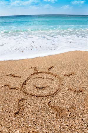 drawing smiling sun symbol on the beach Stock Photo - Budget Royalty-Free & Subscription, Code: 400-06079482