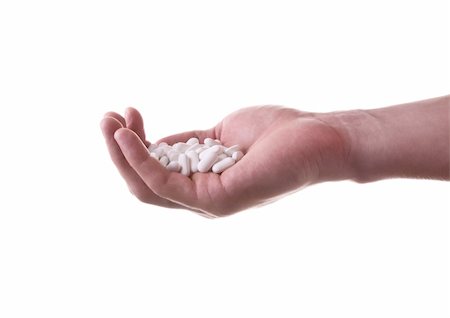 simsearch:632-03897919,k - A hand with a bunch of pills on a white background Foto de stock - Super Valor sin royalties y Suscripción, Código: 400-06079942