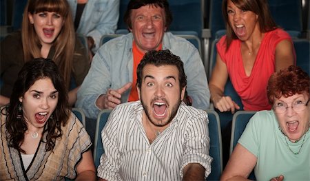 people scared movie theatre - Group of scared people screaming in their seats Stock Photo - Budget Royalty-Free & Subscription, Code: 400-06070079