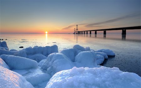 The Danish bridge great belt bridge at sunset on a winter evening Stockbilder - Microstock & Abonnement, Bildnummer: 400-06070083