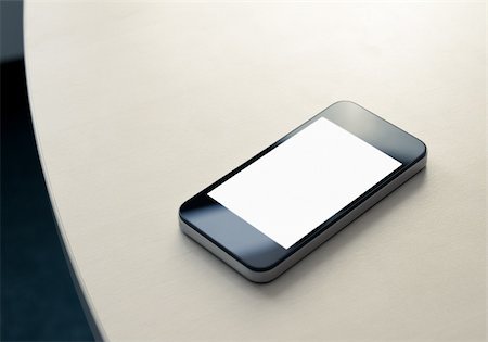 simsearch:400-07309242,k - Mobile smartphone lying on the office table with blank screen. Stock Photo - Budget Royalty-Free & Subscription, Code: 400-06070170