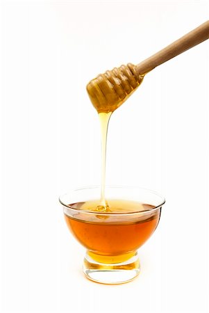 Honey in a glass bowl with a wooden stick Stock Photo - Budget Royalty-Free & Subscription, Code: 400-06070287