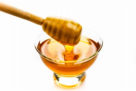 Honey in a glass bowl with a wooden stick Stock Photo - Budget Royalty-Free & Subscription, Code: 400-06070290