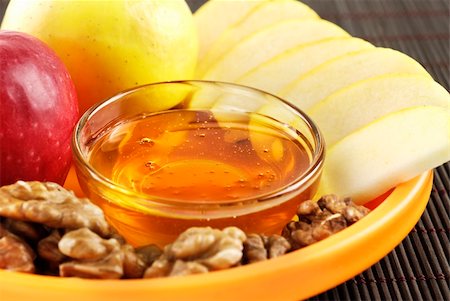 A healthy combination of honey apples and walnuts Stock Photo - Budget Royalty-Free & Subscription, Code: 400-06070291