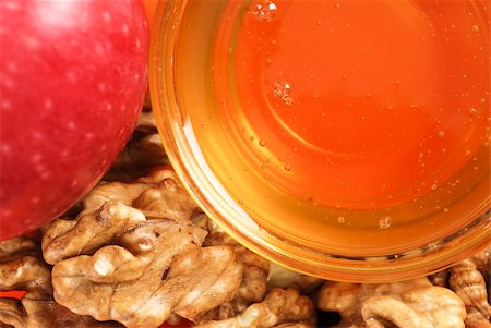 Honey in a glass bowl with red apple and walnut Stock Photo - Budget Royalty-Free & Subscription, Code: 400-06070292