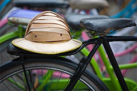 Tropical bamboo helmet on a bicycle in Kota, Jakarta Stock Photo - Budget Royalty-Free & Subscription, Code: 400-06070430