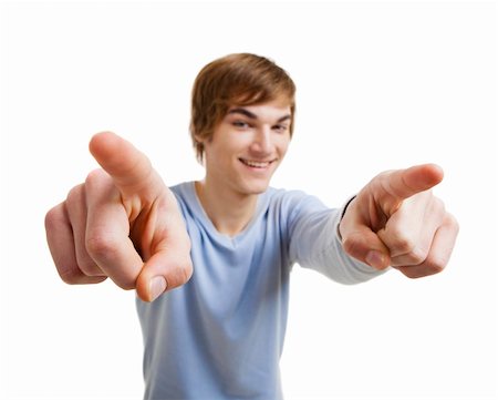simsearch:400-05912376,k - Portrait of a handsome young man looking and pointing to the camera, isolated over a white background Foto de stock - Super Valor sin royalties y Suscripción, Código: 400-06070470