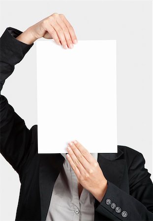 simsearch:400-04364119,k - Woman showing a blank paper sheet in front of her head Fotografie stock - Microstock e Abbonamento, Codice: 400-06070491