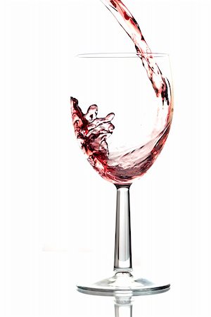 simsearch:400-05676396,k - Red wine pouring into wine glass. White background, reflexion. Stock Photo - Budget Royalty-Free & Subscription, Code: 400-06071037