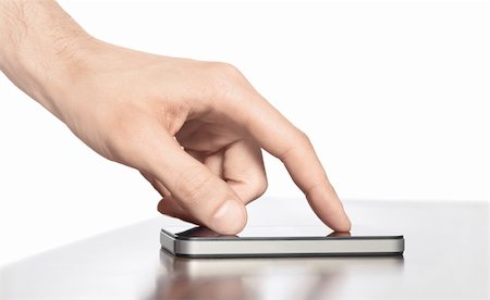 simsearch:400-06568351,k - Man hand touching screen on modern mobile smart phone. Isolated white background. Stockbilder - Microstock & Abonnement, Bildnummer: 400-06071544
