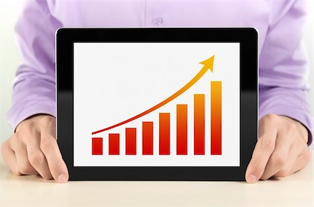 Business man showing tablet pc with success growth graph on screen. Foto de stock - Super Valor sin royalties y Suscripción, Código: 400-06071543