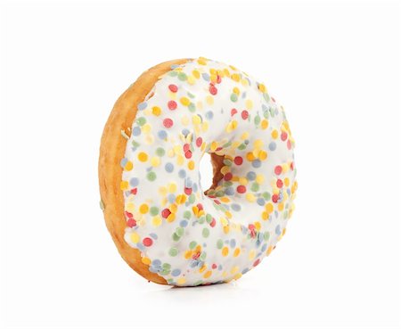 doughnut background - Doughnut covered in sprinkles isolated on white background Stock Photo - Budget Royalty-Free & Subscription, Code: 400-06072274