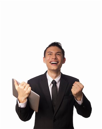 financial meeting tablet - Young Asian Corporate Man with Tablet PC and Clenching his Fists Over white Background Stock Photo - Budget Royalty-Free & Subscription, Code: 400-06072468