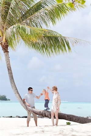 family tropical beach - happy caucasian family with toddler enjoying beach vacation Stock Photo - Budget Royalty-Free & Subscription, Code: 400-06072570