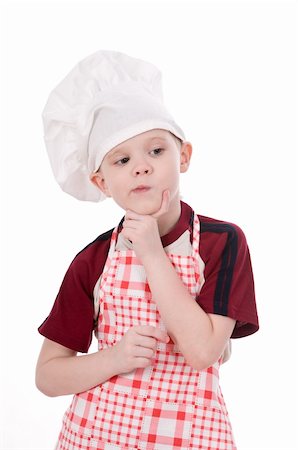 a pensive child chef isolated on white background Fotografie stock - Microstock e Abbonamento, Codice: 400-06072654