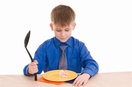 child with a large spoon isolated on white background Fotografie stock - Microstock e Abbonamento, Codice: 400-06072663