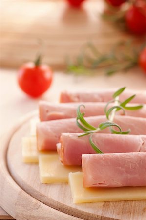 sliced ​​ham - Slices of ham and cheese with rosemary Stock Photo - Budget Royalty-Free & Subscription, Code: 400-06072737