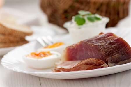 family cheese - Traditional Easter breakfast. Table setting with Boiled eggs with ham, cottage cheese and Easter decorations Stock Photo - Budget Royalty-Free & Subscription, Code: 400-06072749