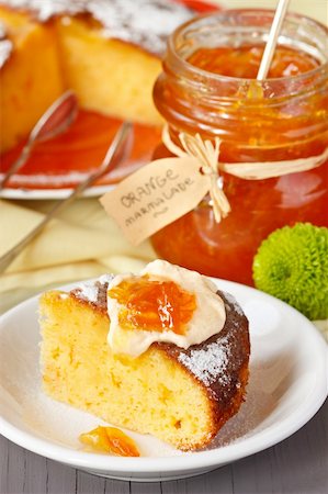 simsearch:400-07428504,k - Sweet orange cake and jar of marmalade for breakfast. Stock Photo - Budget Royalty-Free & Subscription, Code: 400-06072798