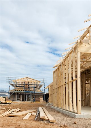 simsearch:400-05344387,k - New residential construction home wooden framing against a blue sky Stock Photo - Budget Royalty-Free & Subscription, Code: 400-06073128