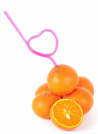 Concept of loving fresh mandarin juice with a straw bent in the shape of a heart inserted into a pile of fresh mandarins Foto de stock - Super Valor sin royalties y Suscripción, Código: 400-06073314