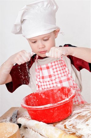 simsearch:400-06078465,k - boy in chef hat knead the dough Stock Photo - Budget Royalty-Free & Subscription, Code: 400-06084228