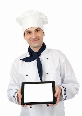 Chef showing a tablet pc with blank screen. Isolated over white background Stock Photo - Budget Royalty-Free & Subscription, Code: 400-06084263