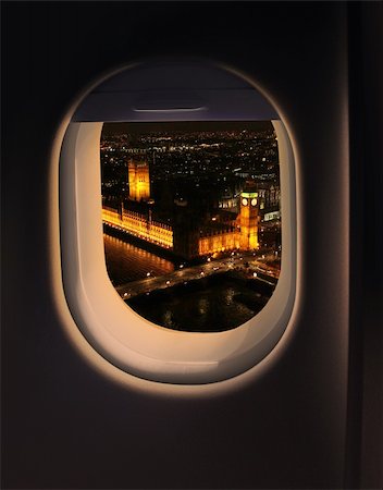 Approaching destination London UK, jet plane window night view Foto de stock - Super Valor sin royalties y Suscripción, Código: 400-06084560