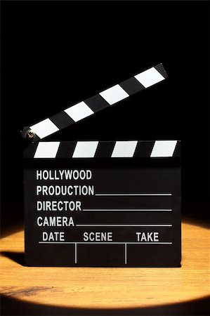 simsearch:400-04742060,k - Movie clapper board under the spotlight Stock Photo - Budget Royalty-Free & Subscription, Code: 400-06084574