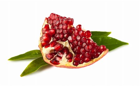 simsearch:400-04294971,k - Part of ripe pomegranate with leaves isolated on white Photographie de stock - Aubaine LD & Abonnement, Code: 400-06084577