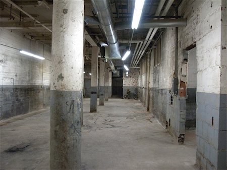 dark empty hall - Empty older warehouse / commercial space with lights on Stock Photo - Budget Royalty-Free & Subscription, Code: 400-06084826