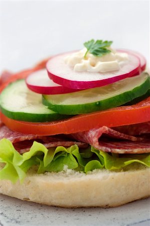 simsearch:400-07568675,k - Delicious ham, cheese and salami sandwich with vegetables, lettuce, cherry tomatoes Foto de stock - Super Valor sin royalties y Suscripción, Código: 400-06085246