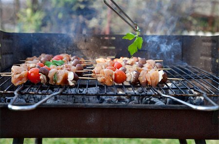 steak bbq flame - Spring barbecue: Chicken and vegetables barbecue in the garden Stock Photo - Budget Royalty-Free & Subscription, Code: 400-06085243