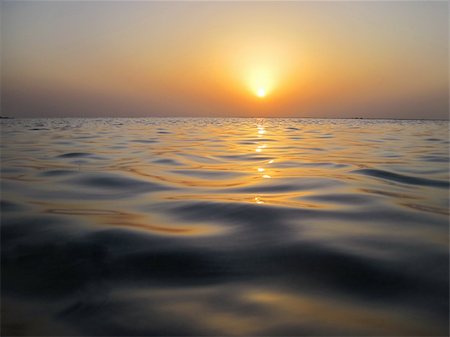 red rocks horizon - many smooth soft waves in the warm sunset on the sea and holiday Stock Photo - Budget Royalty-Free & Subscription, Code: 400-06085358