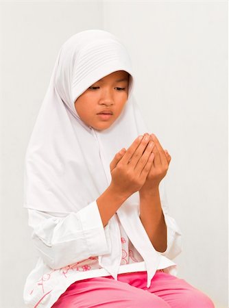 photos of little girl praying - Muslim Little girl praying Stock Photo - Budget Royalty-Free & Subscription, Code: 400-06085680