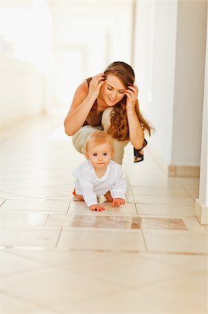 simsearch:400-06086432,k - Happy mother playing with baby Stockbilder - Microstock & Abonnement, Bildnummer: 400-06086388