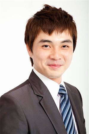 simsearch:400-06091141,k - smiling asian businessman Photographie de stock - Aubaine LD & Abonnement, Code: 400-06087164